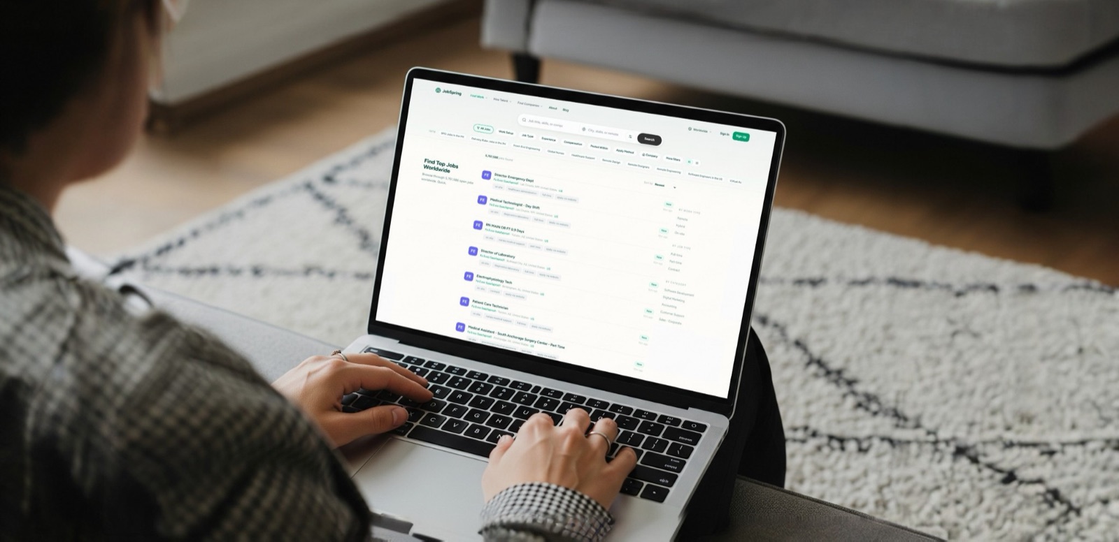 Someone browsing open roles on JobSpring