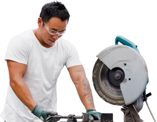 Man wearing eye protection working with a circular saw.